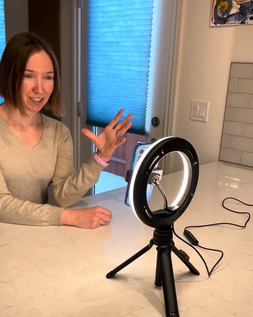 Jamie recording content with a ring light