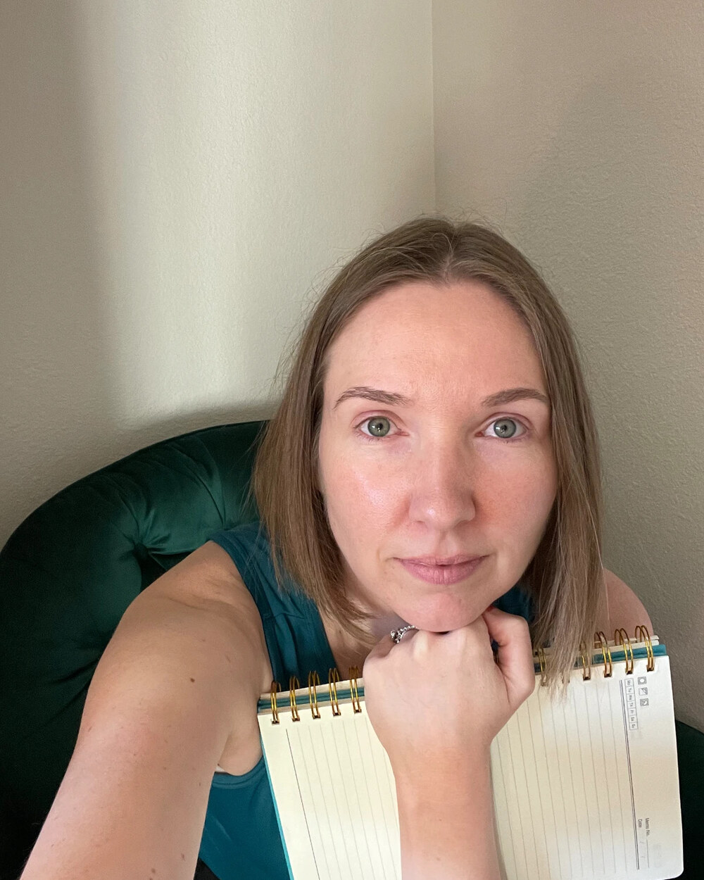 Jamie journaling with a notebook